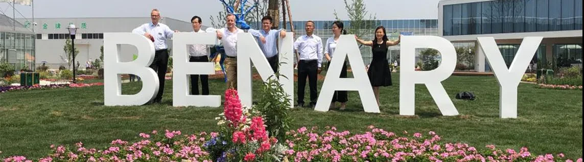 Benary Flower Trials in China, the Officials standing in front of hugh letters, resulting in the word benary