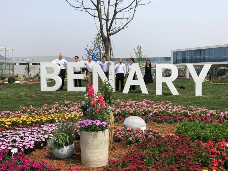 Benary Flower Trials in China, the Officials standing in front of huge letters that are forming in the word Benary